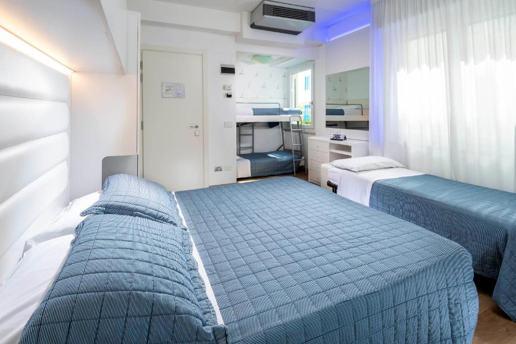 Postel nebo postele na pokoji v ubytování Hotel Albatros
