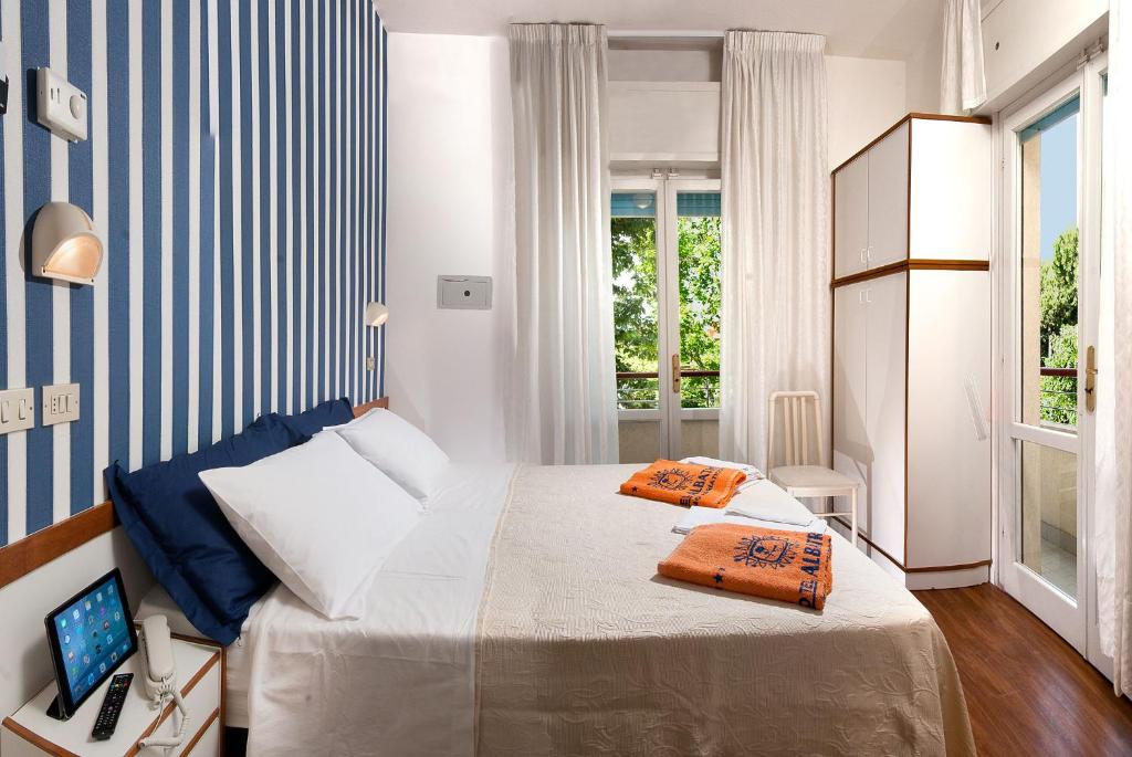 Postel nebo postele na pokoji v ubytování Hotel Albatros