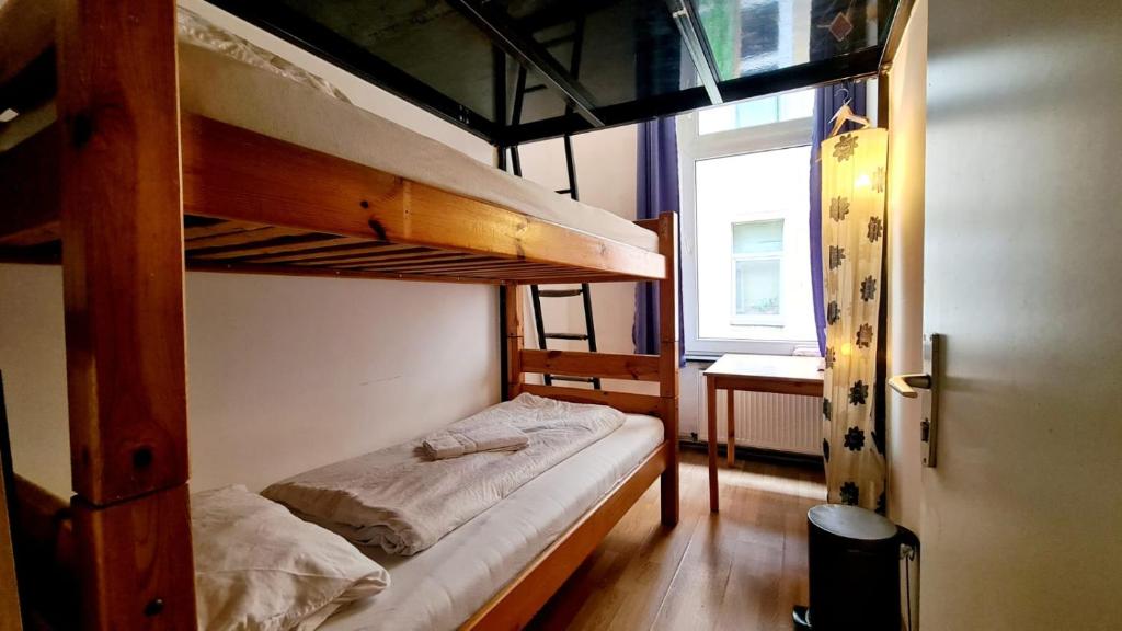 Postel nebo postele na pokoji v ubytování Freiraum Hostel Kreuzberg