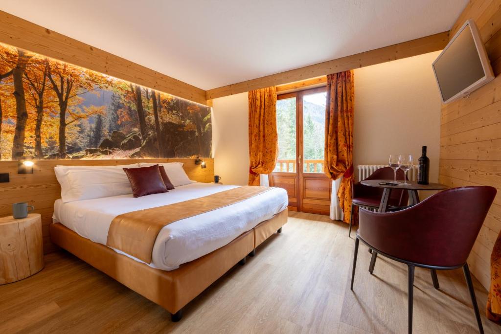 Postel nebo postele na pokoji v ubytování Hotel Petit Tournalin