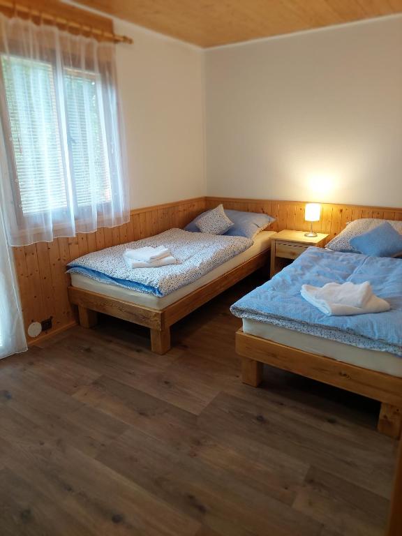 Postel nebo postele na pokoji v ubytování ZÁTOKA Živohošť - Apartmány
