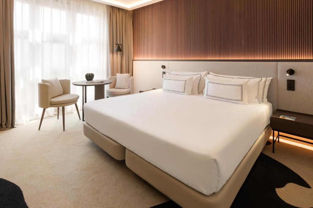 Кровать или кровати в номере Hotel Meliá Bilbao