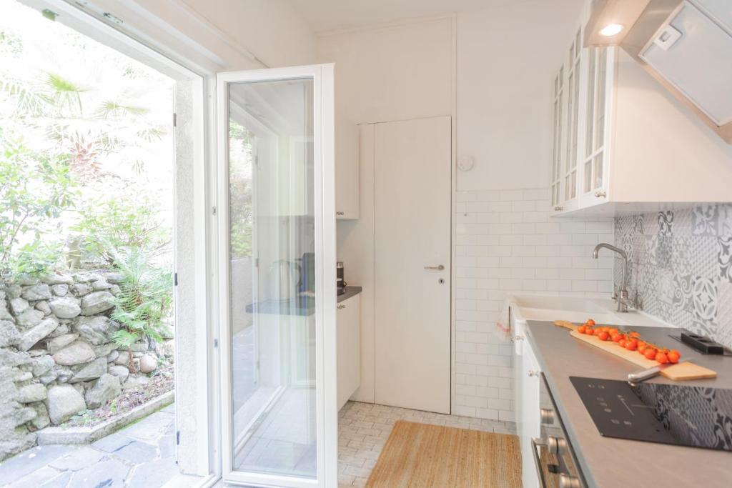 A kitchen or kitchenette at Top Lake View Villetta by Rent All Como