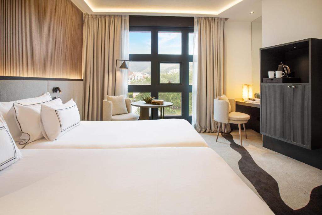 Кровать или кровати в номере Hotel Meliá Bilbao