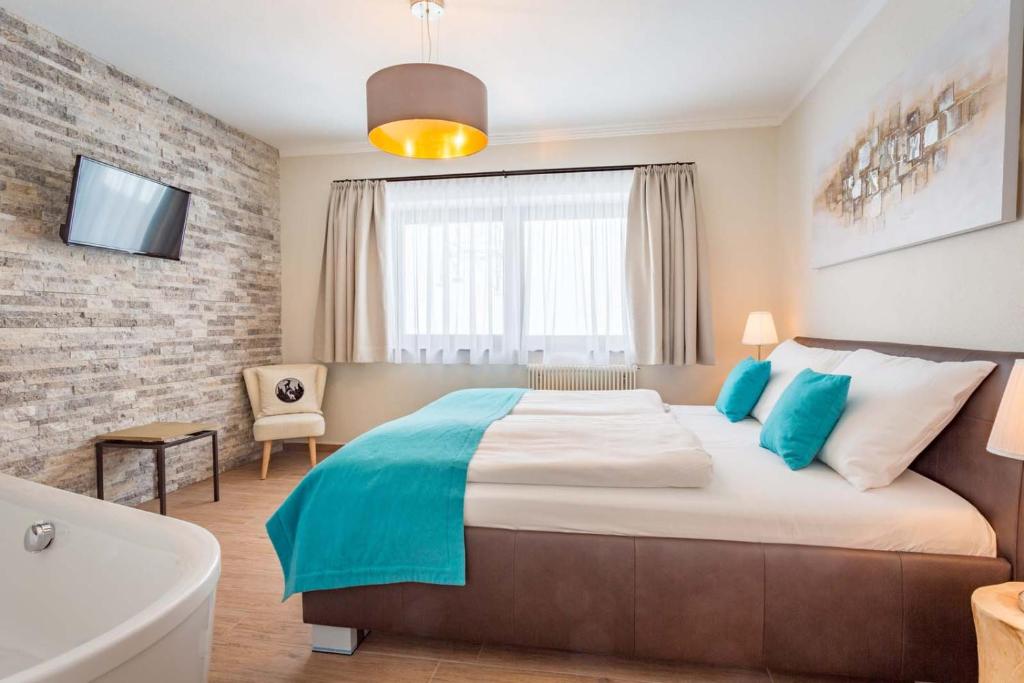 Postel nebo postele na pokoji v ubytování Berghotel Ronach