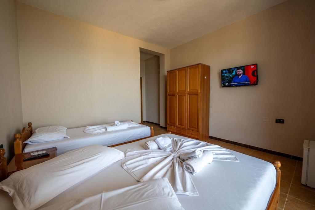 Postel nebo postele na pokoji v ubytování Hotel Nika Radhime