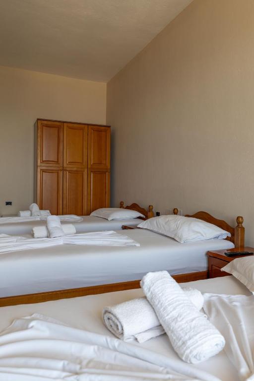 Postel nebo postele na pokoji v ubytování Hotel Nika Radhime