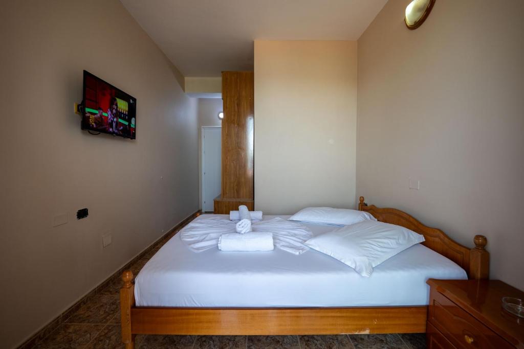 Postel nebo postele na pokoji v ubytování Hotel Nika Radhime