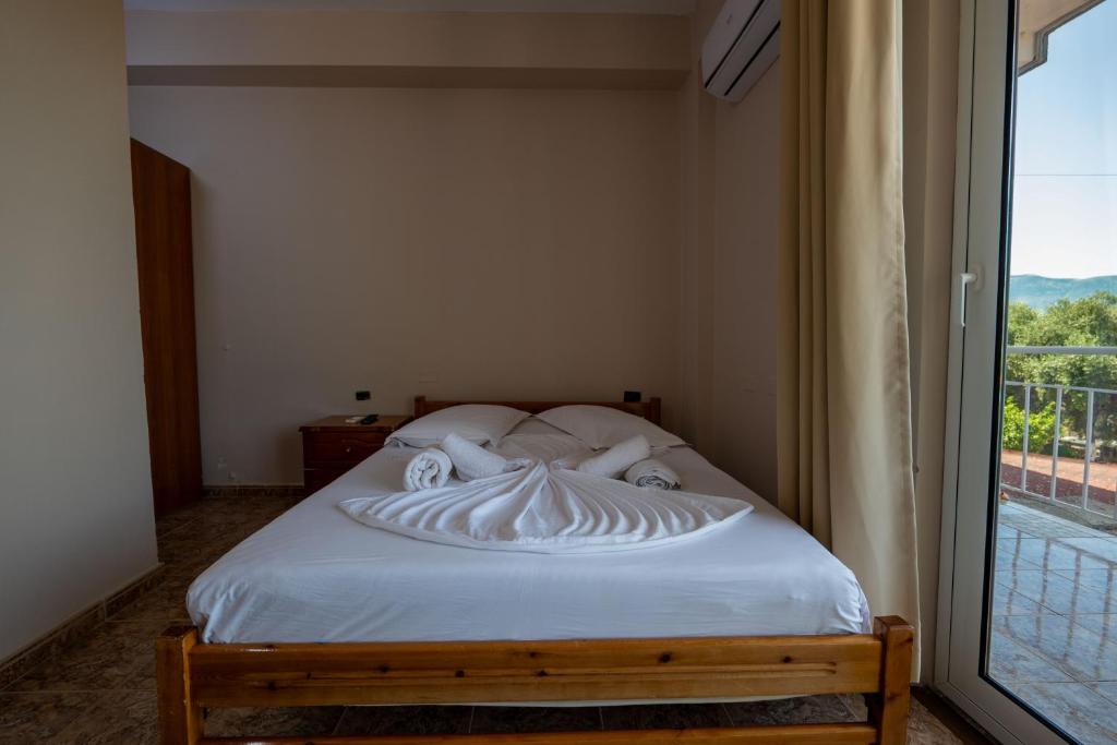 Postel nebo postele na pokoji v ubytování Hotel Nika Radhime