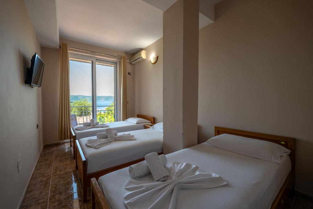 Postel nebo postele na pokoji v ubytování Hotel Nika Radhime