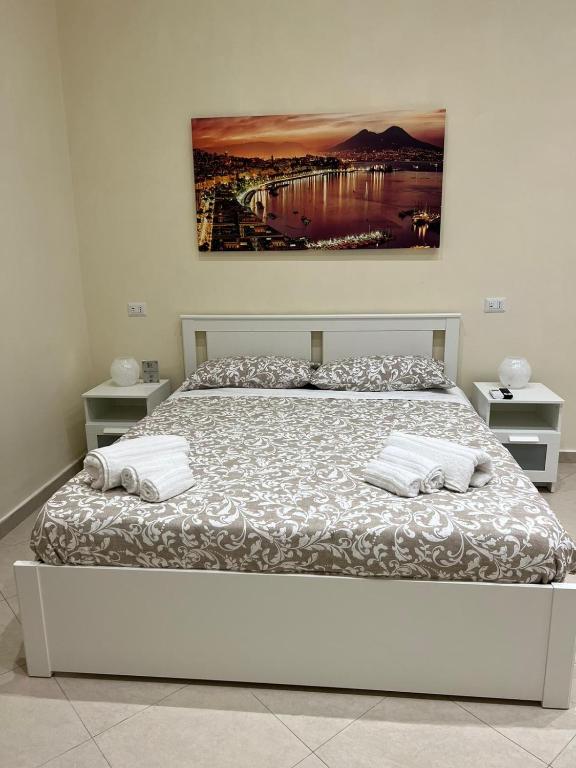 a bed with two pillows on it in a bedroom at Re Umberto 311 in Naples