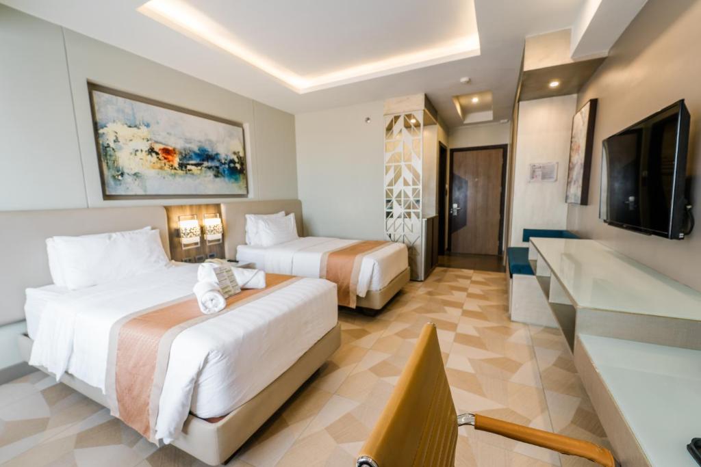 TV a/nebo společenská místnost v ubytování Zuri Hotel