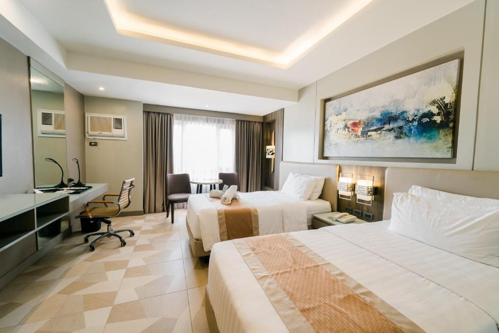 Postel nebo postele na pokoji v ubytování Zuri Hotel