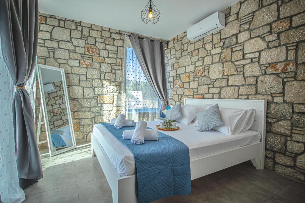 Postel nebo postele na pokoji v ubytování Anasa Rustic Villa