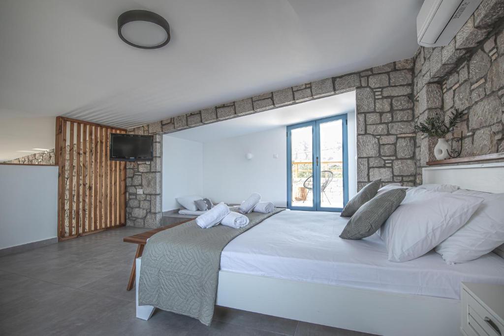 Postel nebo postele na pokoji v ubytování Anasa Rustic Villa