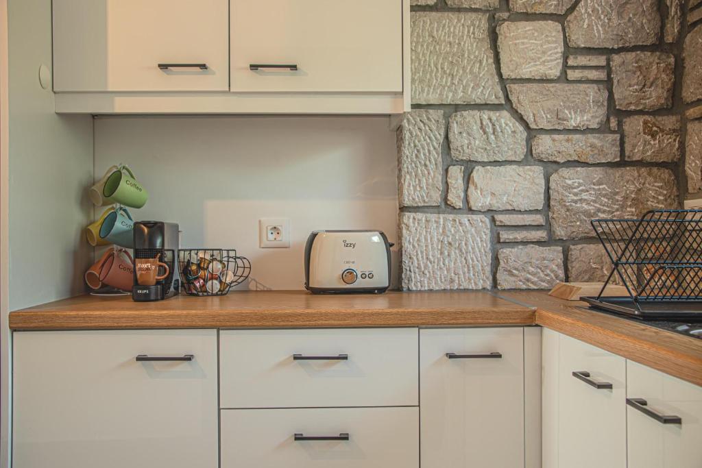 Kuchyň nebo kuchyňský kout v ubytování Anasa Rustic Villa