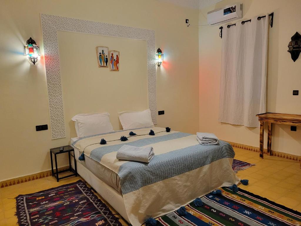 Postel nebo postele na pokoji v ubytování Le Domaine M