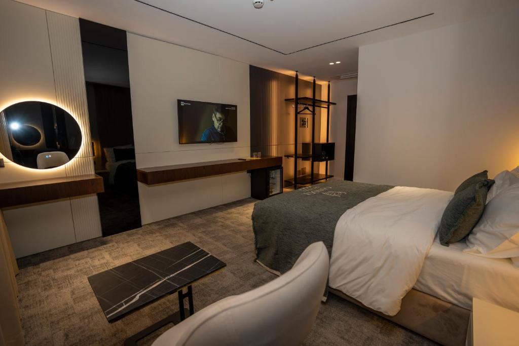 Postelja oz. postelje v sobi nastanitve Hotel Consul