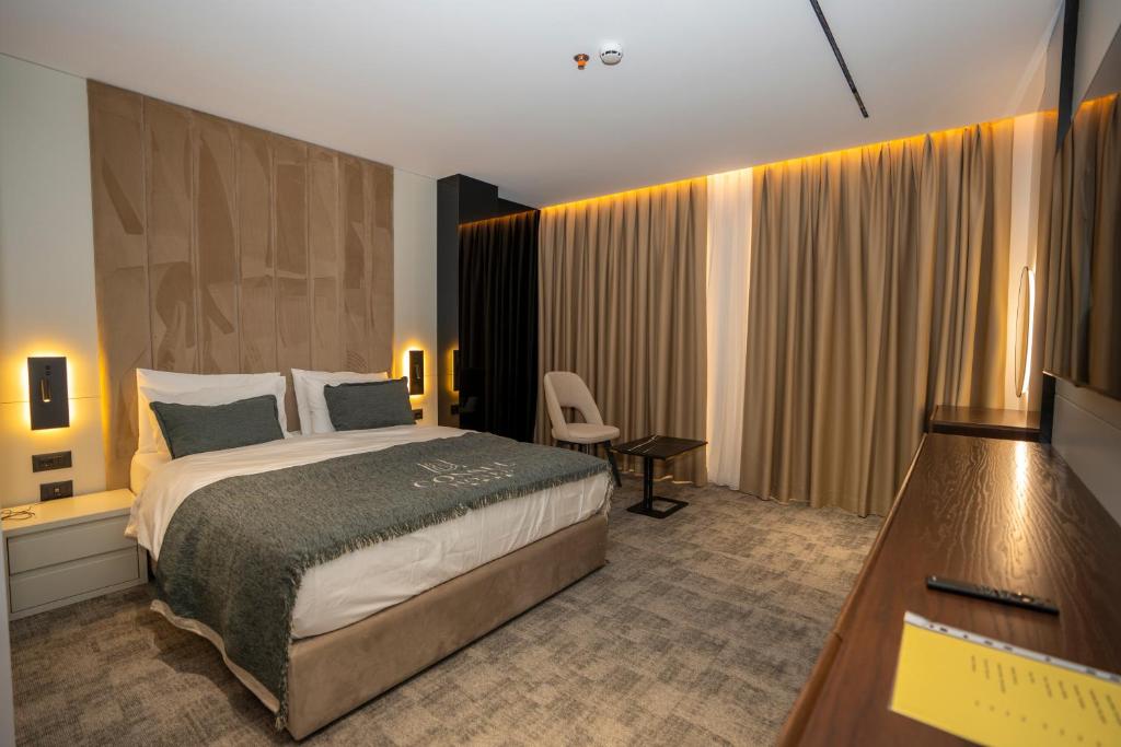 Postelja oz. postelje v sobi nastanitve Hotel Consul