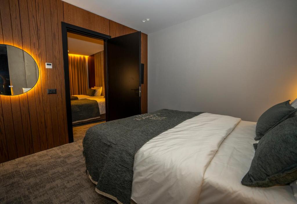Postelja oz. postelje v sobi nastanitve Hotel Consul