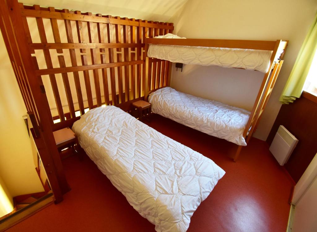 Postel nebo postele na pokoji v ubytování La Petite Fecht