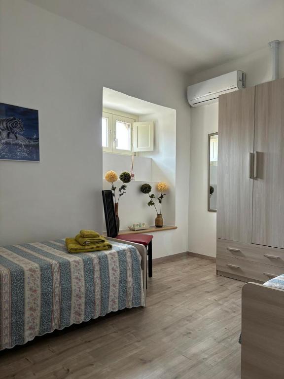 Postel nebo postele na pokoji v ubytování Al Castello Apartment