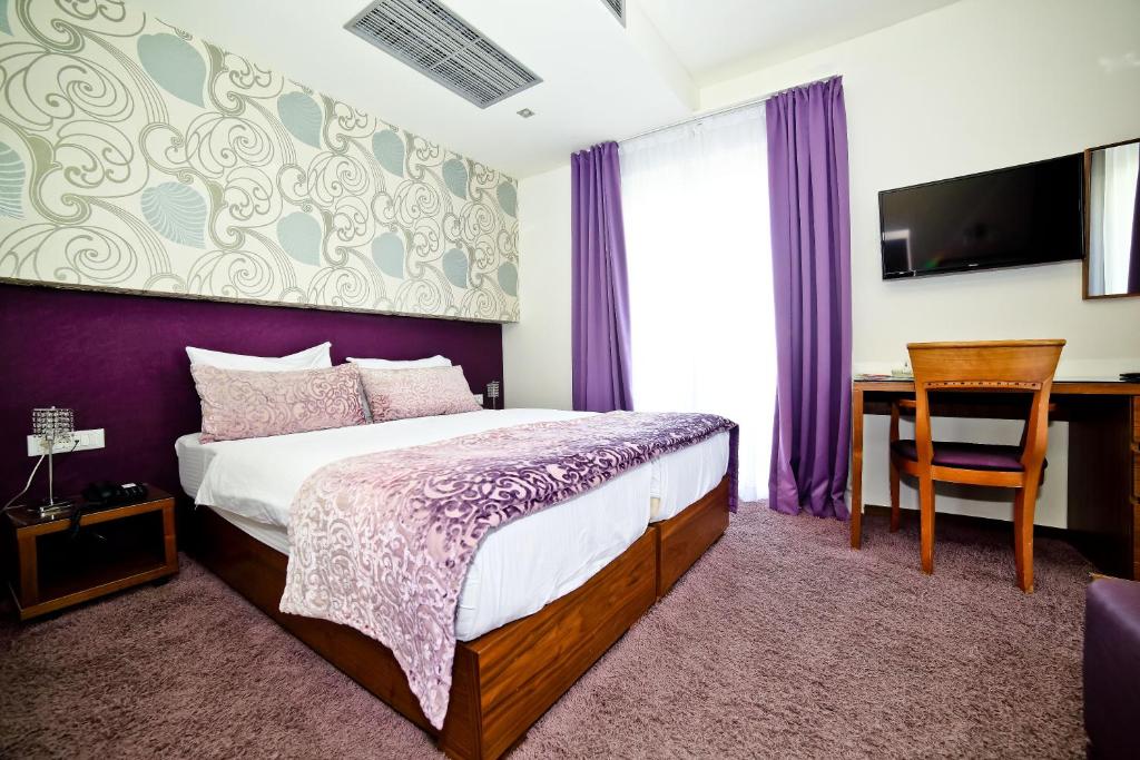 Postelja oz. postelje v sobi nastanitve Hotel Gala Split