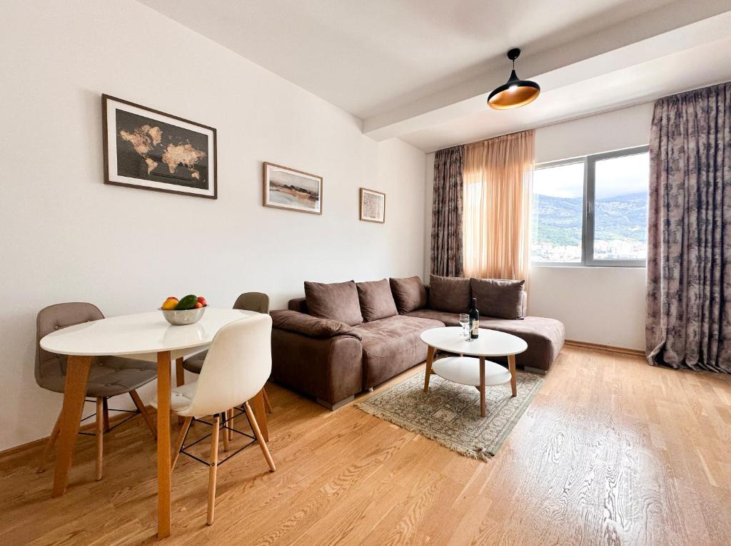 a living room with a couch and a table at Mediterranean Apartment 2 in Budva