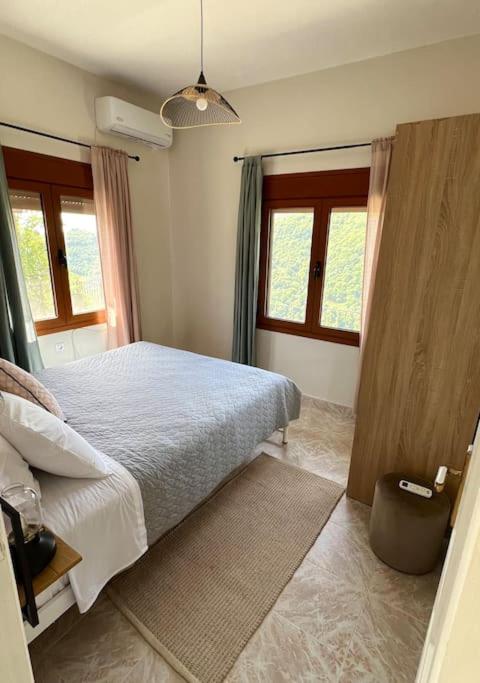 Postel nebo postele na pokoji v ubytování Alexias Home