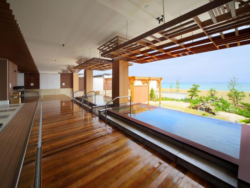 Bazén v ubytování Kamogawa Grand Hotel nebo v jeho okolí