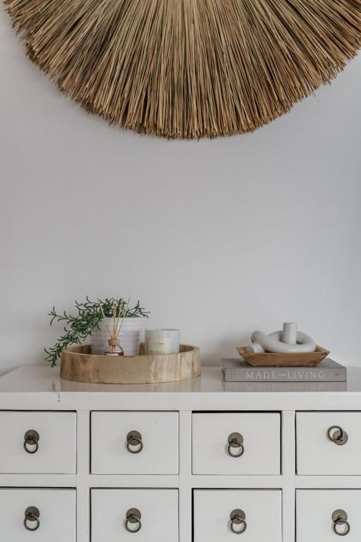 a white dresser with a rug on top of it at GuestReady - Bohemian Apt with Marina View in Dubai
