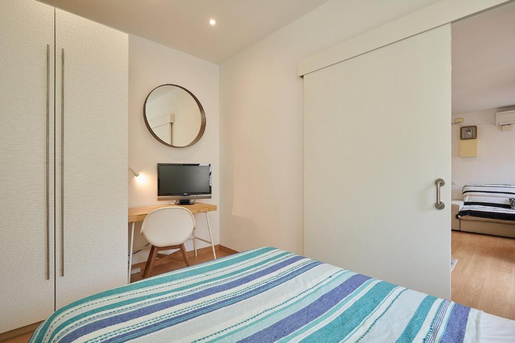 Cama o camas de una habitación en GuestReady - Acogedor Apt en La Barceloneta