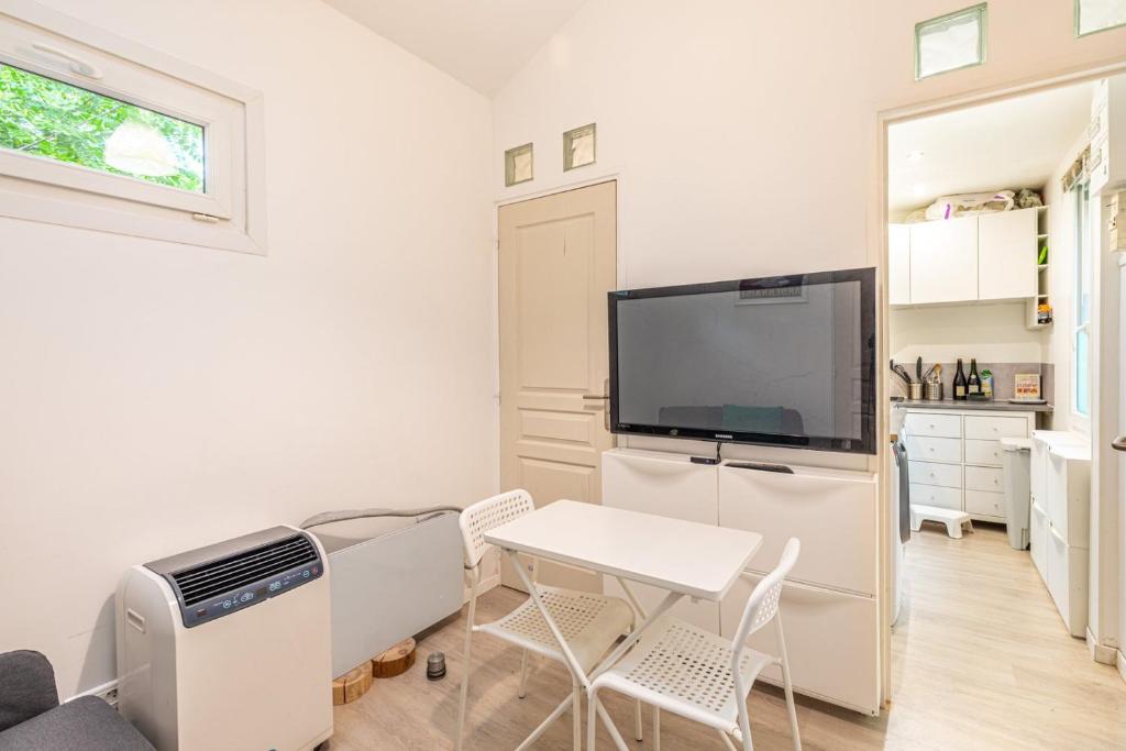 Photo de la galerie de l'établissement GuestReady - Appart. confortable avec jardin privé, aux Lilas