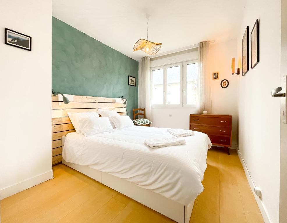 En eller flere senge i et værelse på La maison de la Garenne