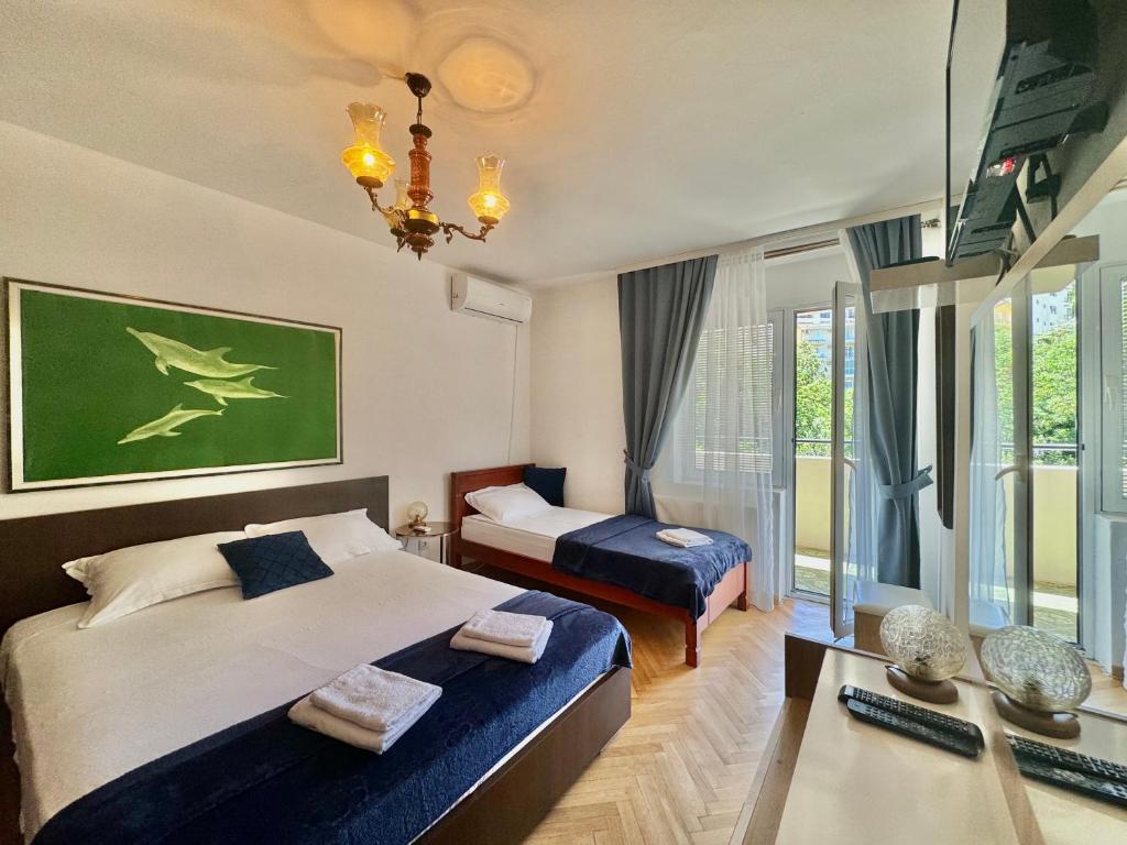 Postel nebo postele na pokoji v ubytování FOR-A Apartmani