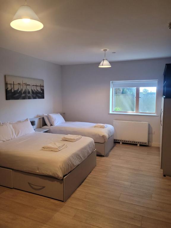 Postel nebo postele na pokoji v ubytování SWUITE GALWAY