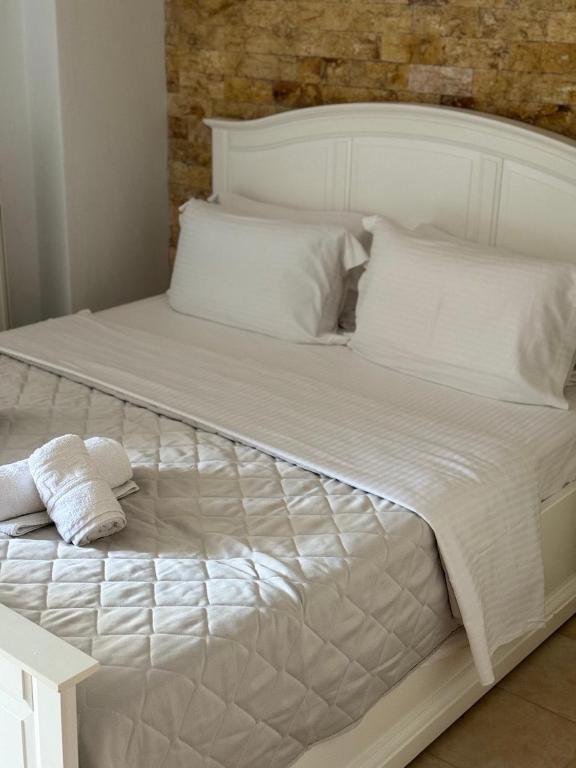 Postel nebo postele na pokoji v ubytování Amaryllis House