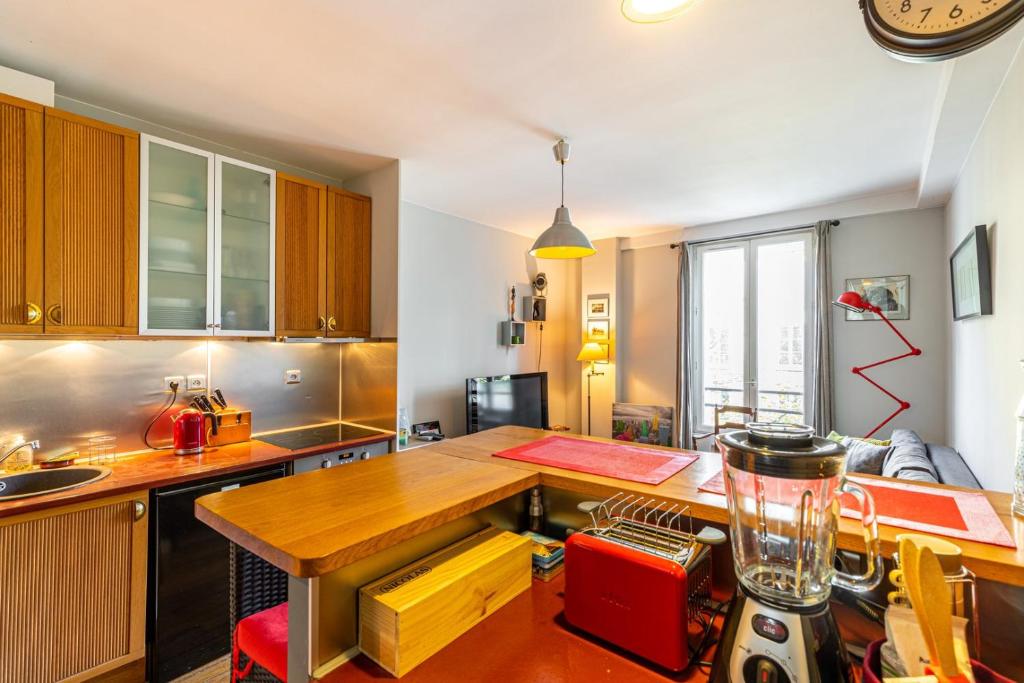 Kuchnia lub aneks kuchenny w obiekcie GuestReady - Amazing stay in the 19th arr.
