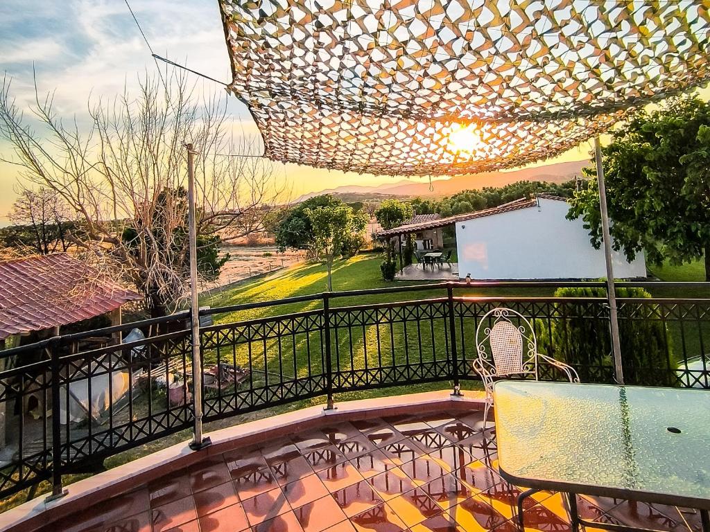 a balcony with a view of a house at Bella Vista in Dhíkella