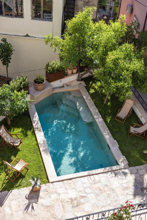 an overhead view of a swimming pool in a yard at NEW - Casa Columba - 4 Star Design Boutique Hotel with Outdoor Pool & Private Garden in Makarska