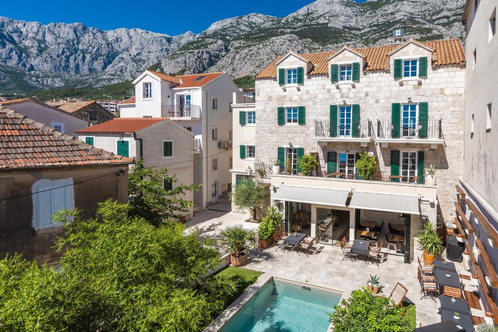 an aerial view of a building with a swimming pool at NEW - Casa Columba - 4 Star Design Boutique Hotel with Outdoor Pool & Private Garden in Makarska