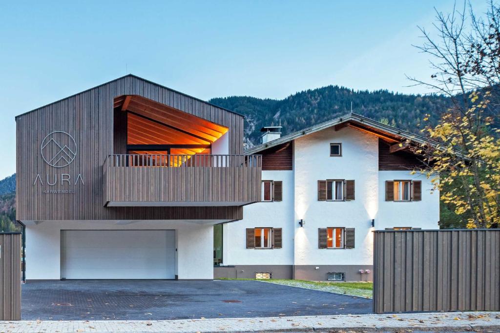 a house with a balcony on the side of it at AuraKarwendel in Scharnitz