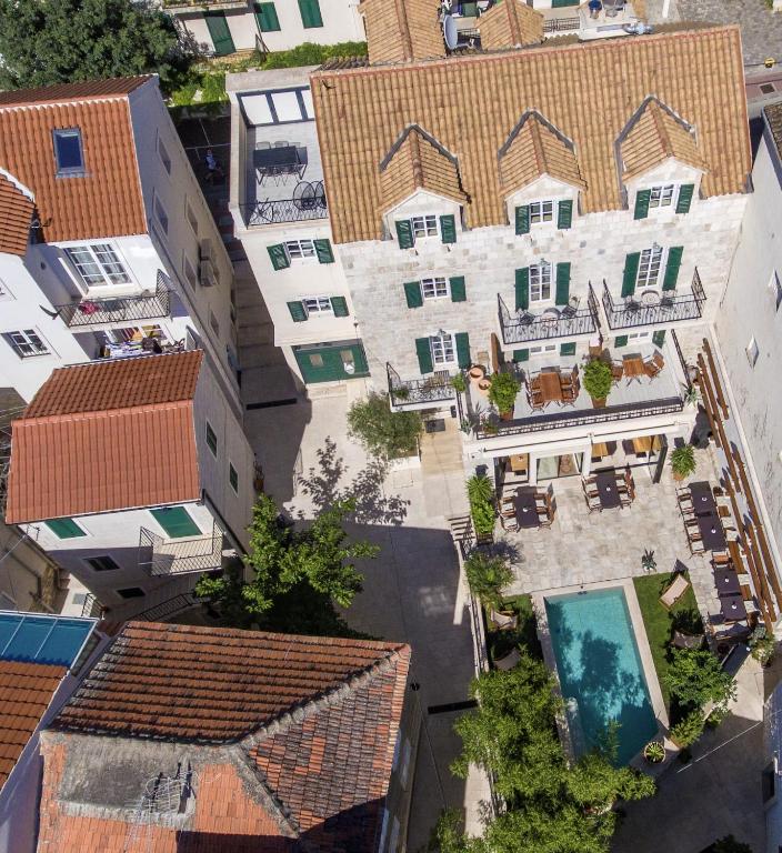 an overhead view of a building with a swimming pool at NEW - Casa Columba - 4 Star Design Boutique Hotel with Outdoor Pool & Private Garden in Makarska
