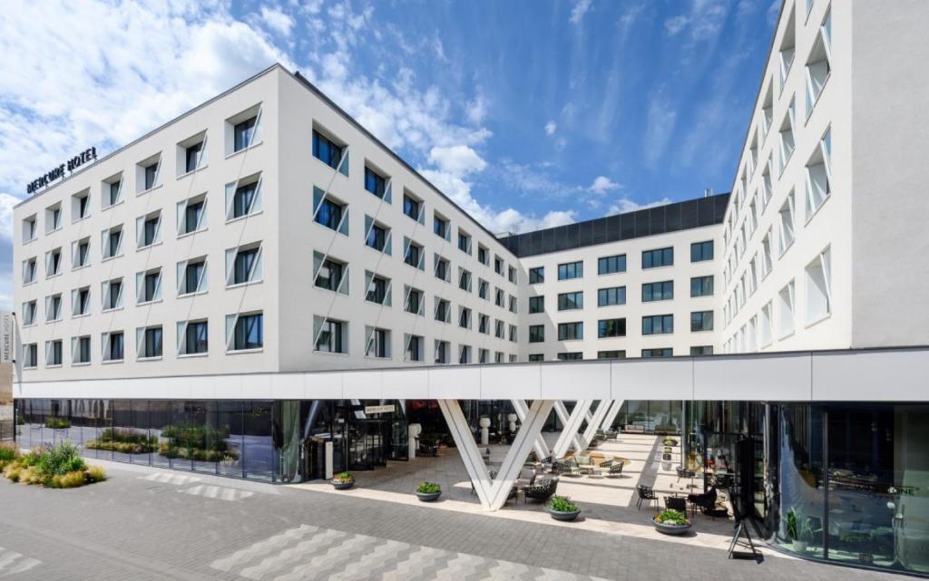 an office building with a walkway in front of it at Mercure Debrecen in Debrecen