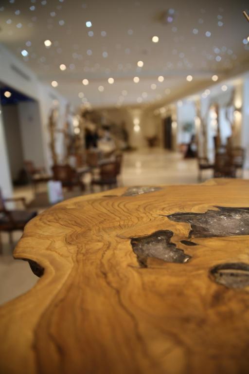 a close up of a wooden table in a room at Hôtel Campo Dell'oro in Ajaccio