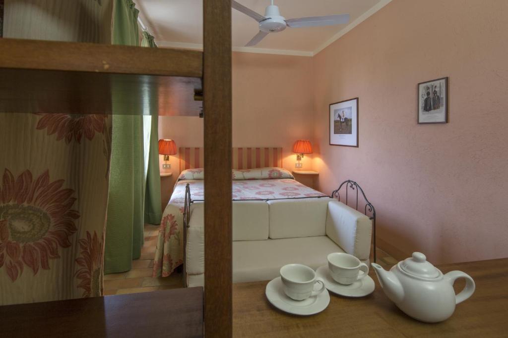 Łóżko lub łóżka w pokoju w obiekcie Agriturismo Il Torrione