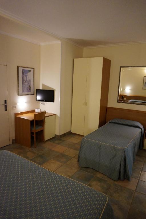 Postel nebo postele na pokoji v ubytování Hotel Angela