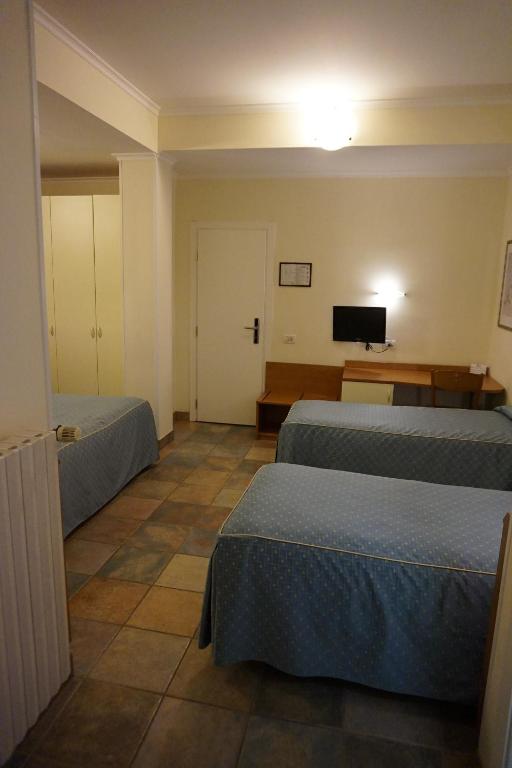 Postel nebo postele na pokoji v ubytování Hotel Angela