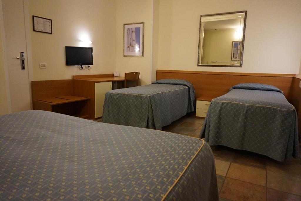 Postel nebo postele na pokoji v ubytování Hotel Angela