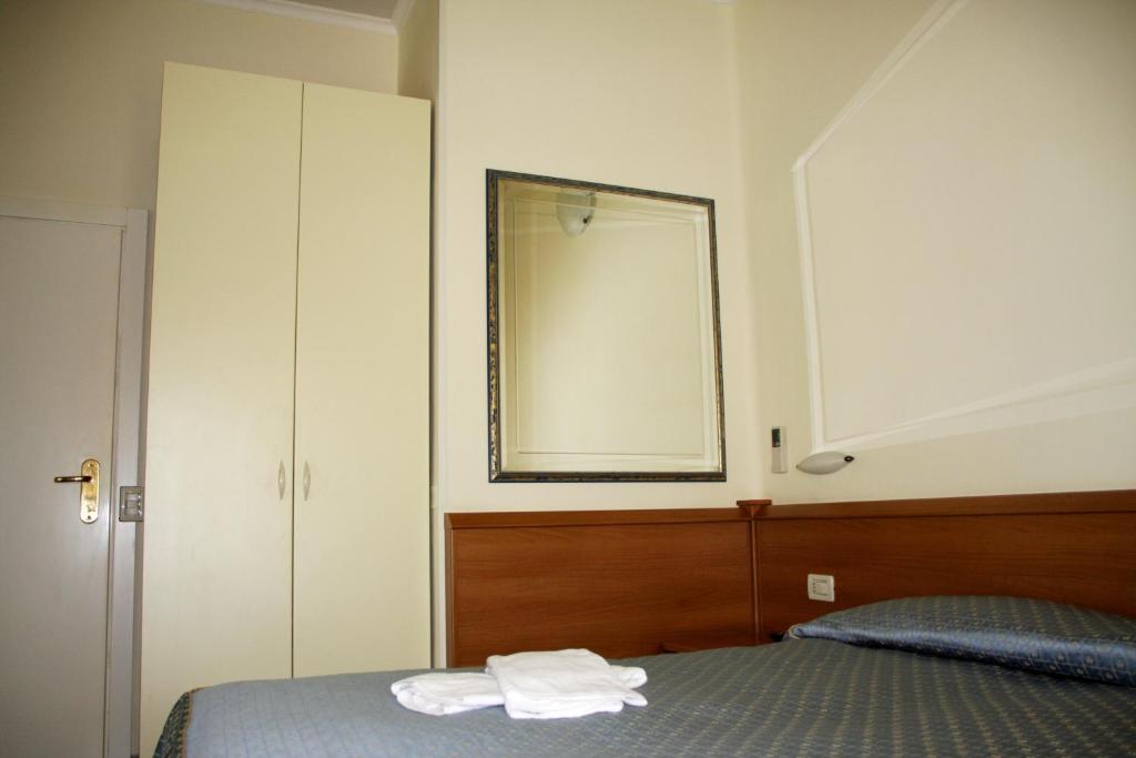 Postel nebo postele na pokoji v ubytování Hotel Angela